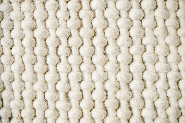 Ivory loop chunky wool rug, flat lay view