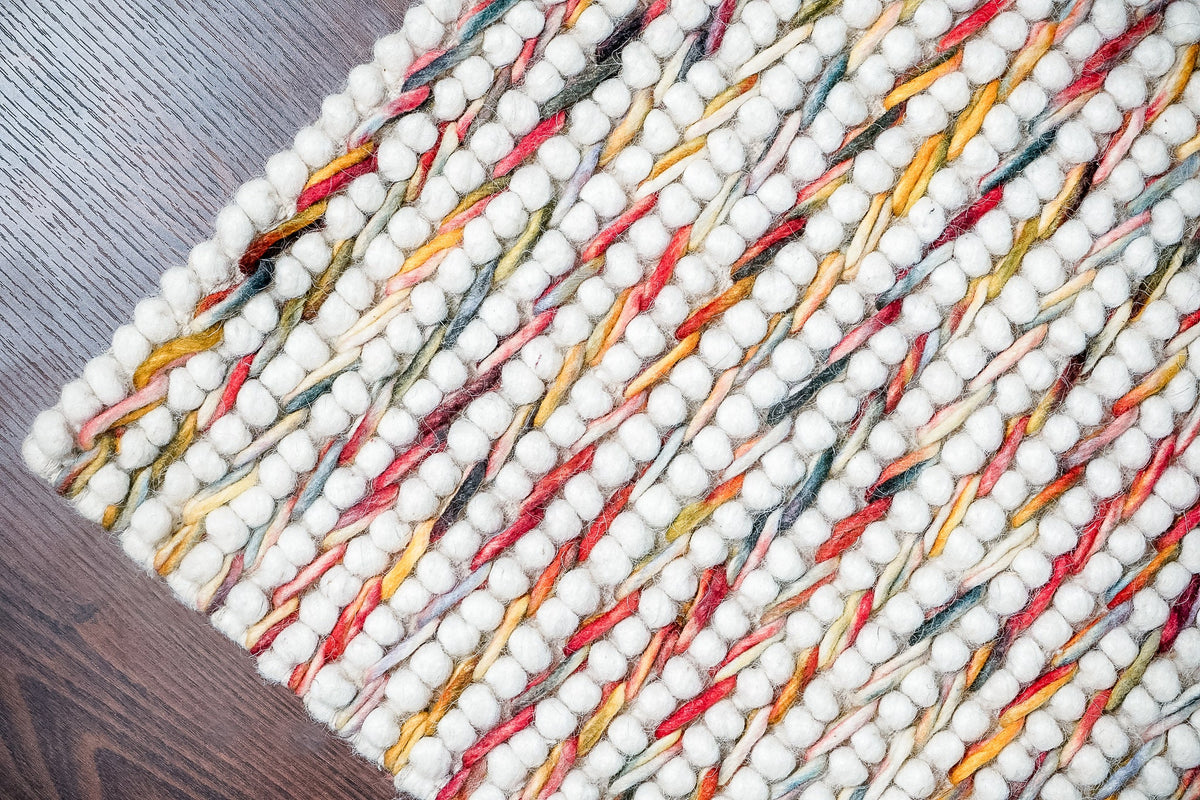Colourful wool rug styled in a kids room