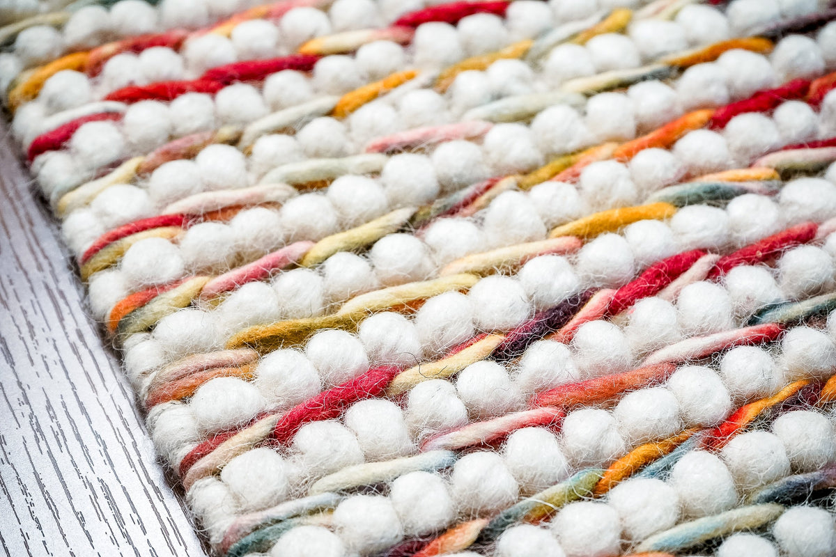 Multi colour chunky loop wool rug flat lay