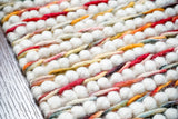 Multi colour chunky loop wool rug flat lay