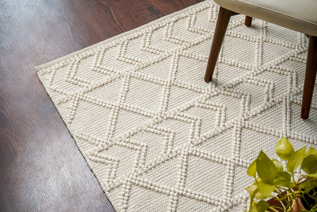 Abstract ivory chunky wool rug, flat lay view