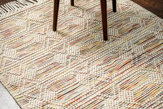 Chunky looped wool rug flat view showing colourful abstract pattern