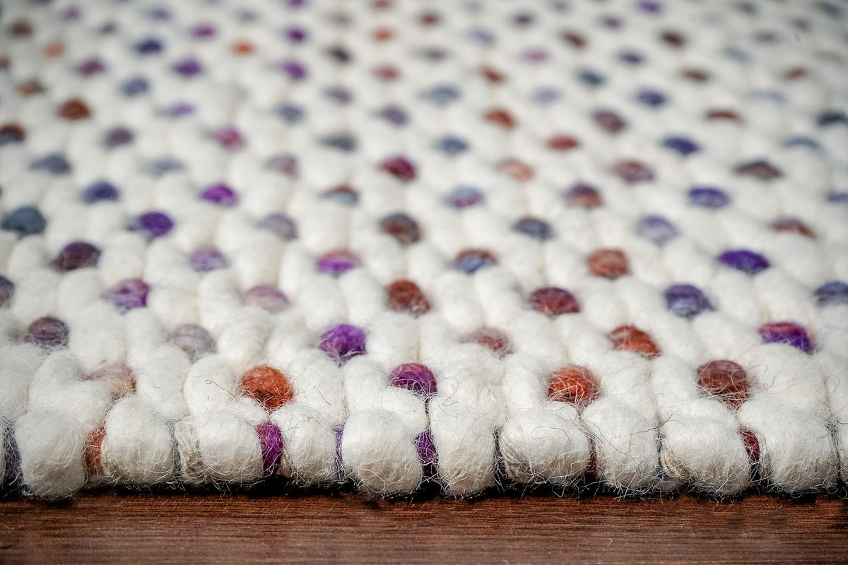 Purple chunky loop rug corner detail