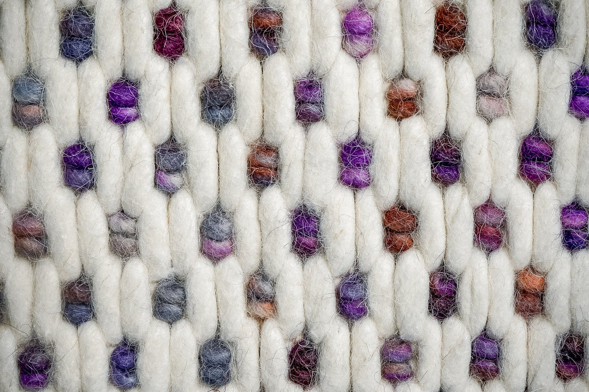Ivory purple rug in a nursery setting
