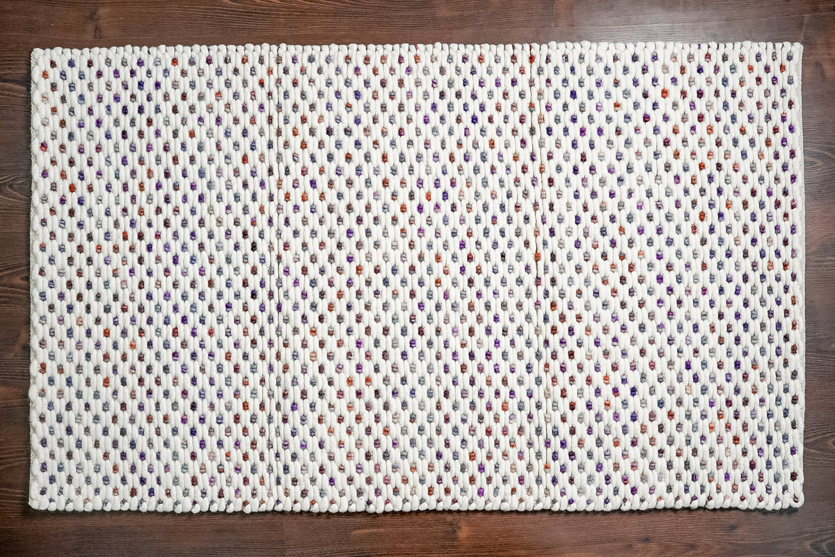 Chunky loop rug styled in a living room
