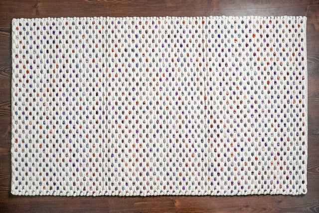 Chunky loop rug styled in a living room