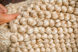 Close-up of chunky wool loop texture