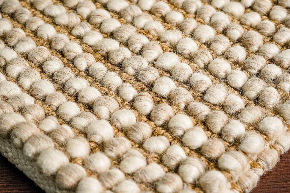 Chunky camel beige wool rug, flat lay view