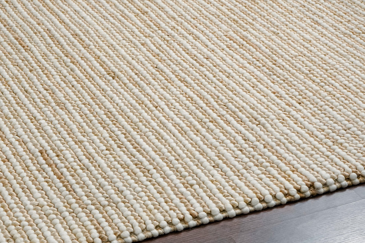Natural wool jute rug styled with farmhouse decor