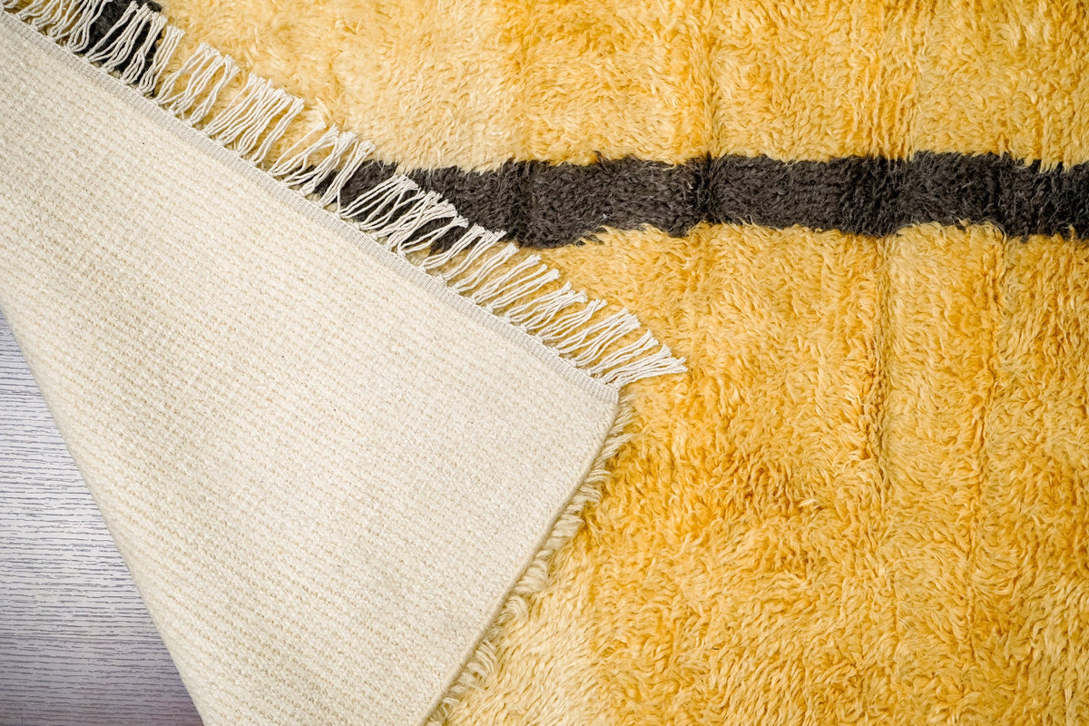 Berber rug corner detail showing hand-knotted edge