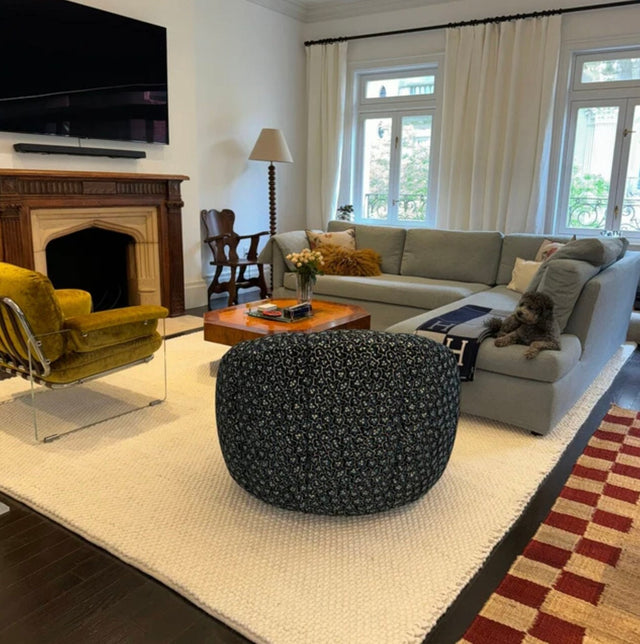 Ivory wool rug styled in a living room