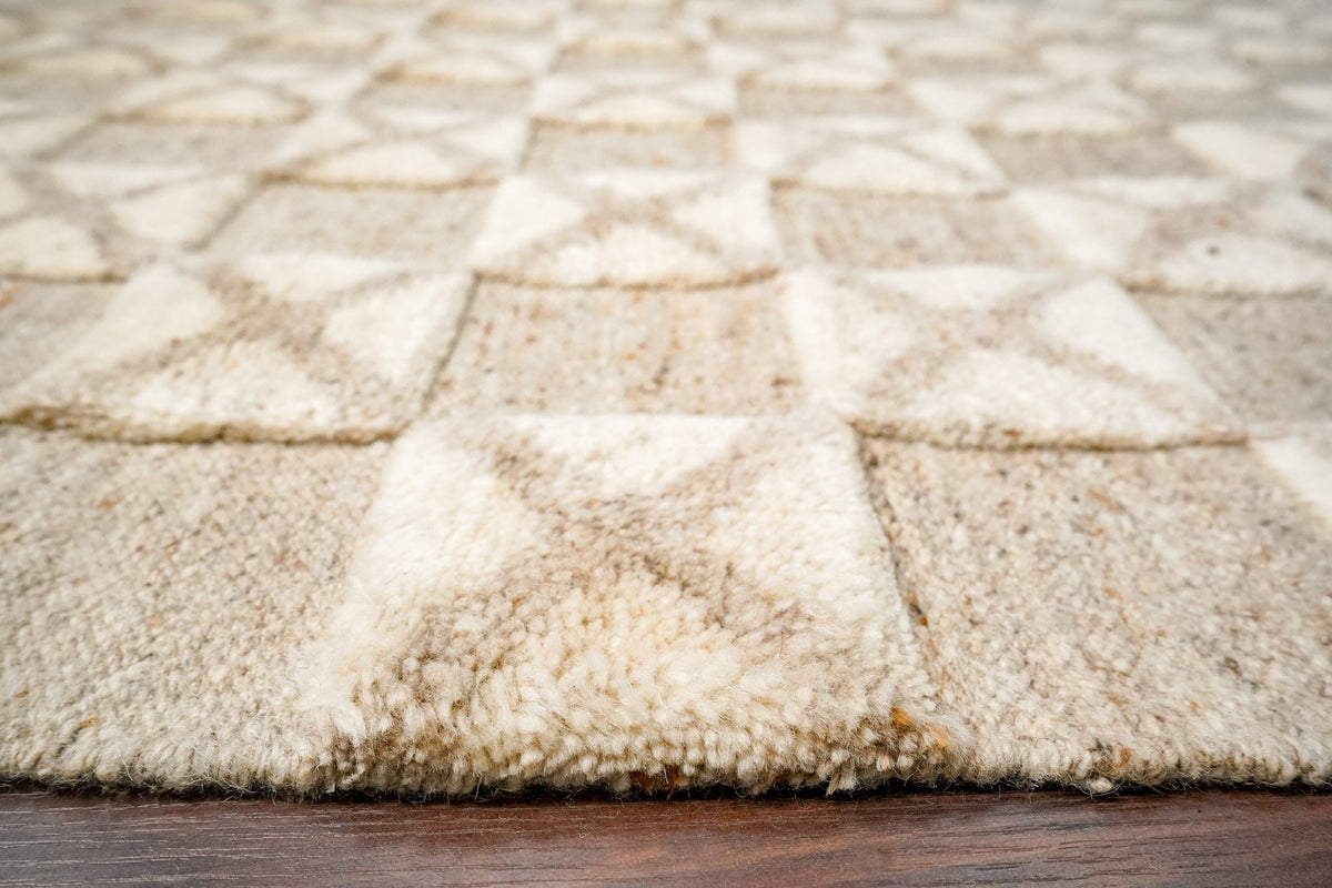 Taupe wool rug geometric pattern detail close-up