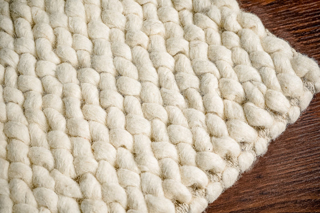 Ivory chunky looped wool rug, full flat view
