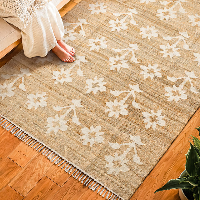Natural jute flower pattern rug, flat lay view
