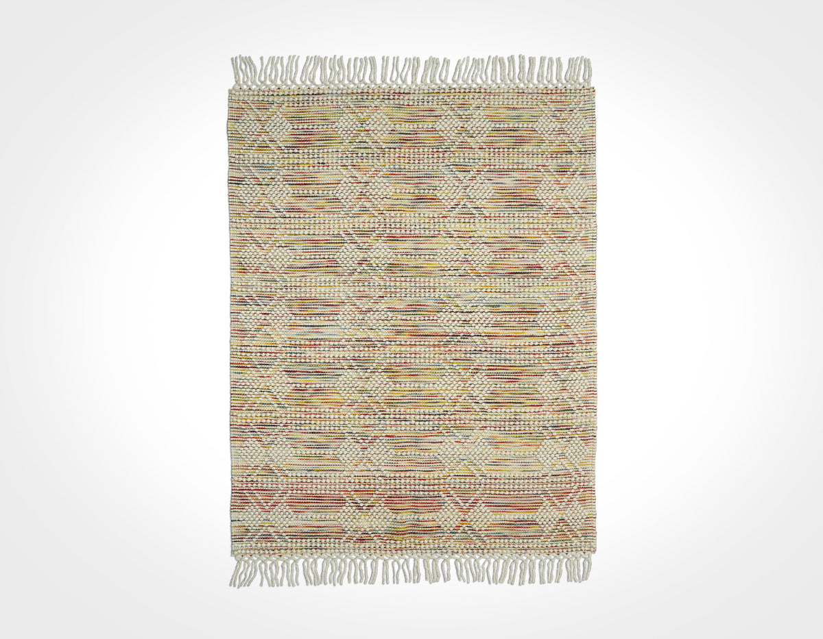 Chunky looped wool rug rolled for shipping