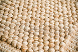 Chunky beige wool rug, flat lay view