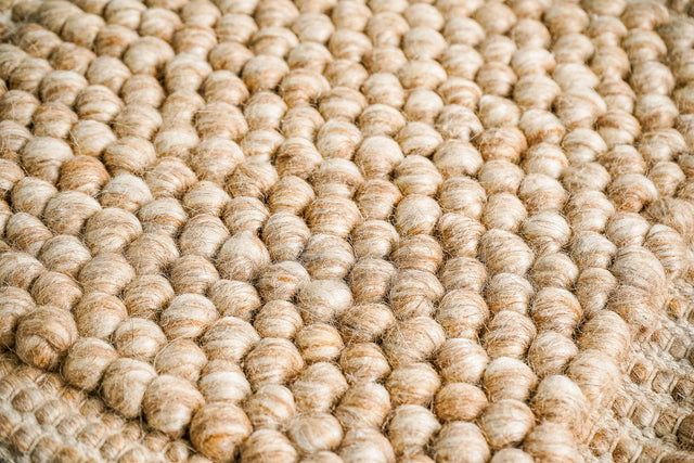 Chunky beige wool rug, flat lay view