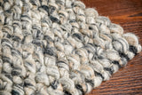 Grey mix chunky looped wool rug, flat lay view