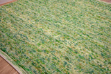 Sage green rug pile close-up