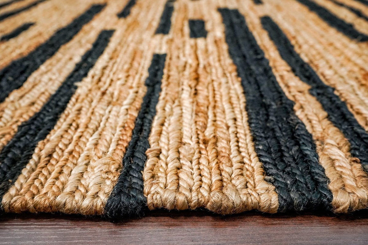 Black striped hemp rug on a covered porch