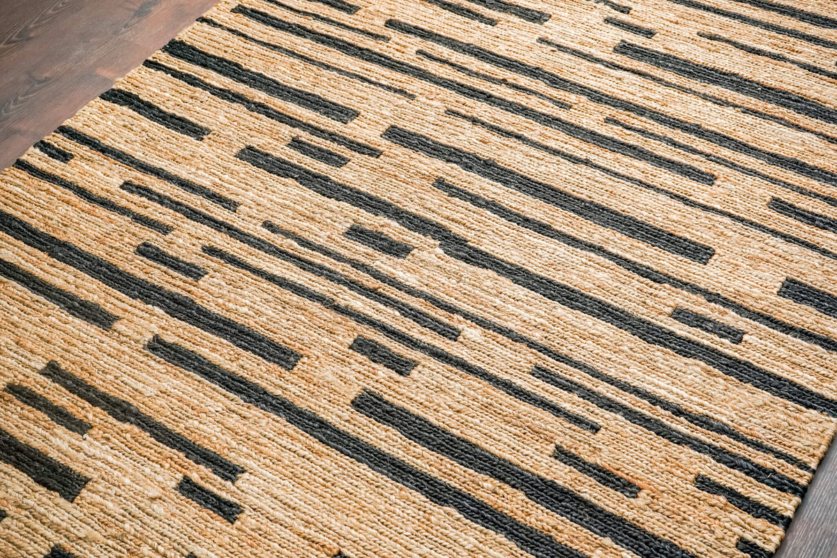 Full room view with black striped hemp rug