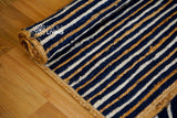 Blue jute rug styled in a living room
