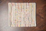 Chunky wool rug texture and color close-up detail