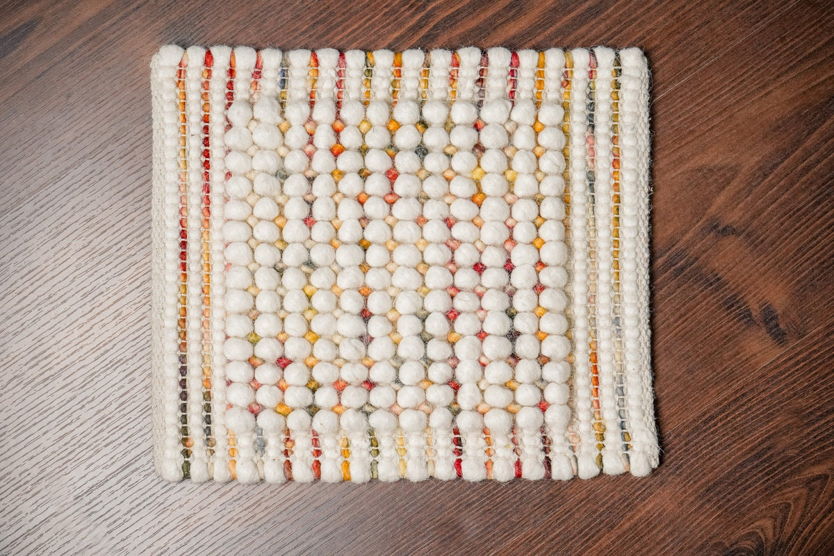 Chunky wool rug texture and color close-up detail