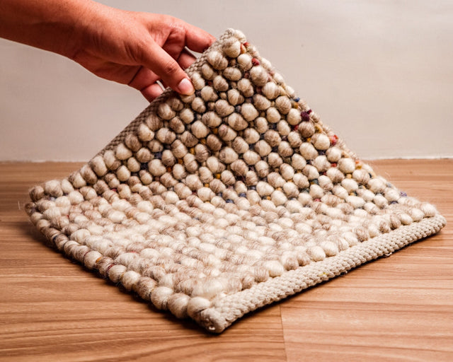 Taupe beige chunky loop wool rug, flat lay view