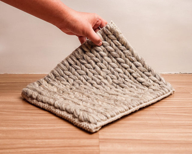 Chunky braided loop taupe grey wool rug, flat lay view