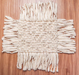 Ivory wool rug fringe edge detail