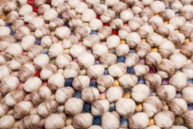 Taupe rug styled in living room