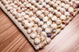 Taupe beige rug styled in hallway