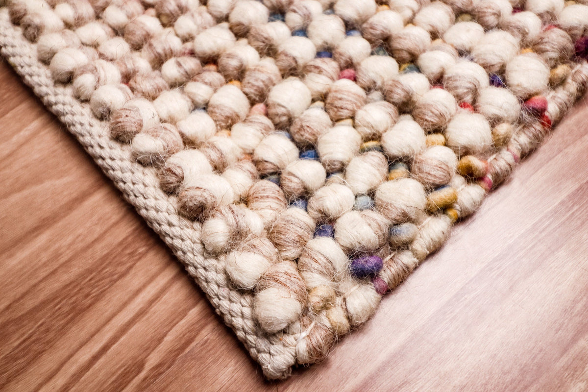 Taupe beige rug styled in hallway