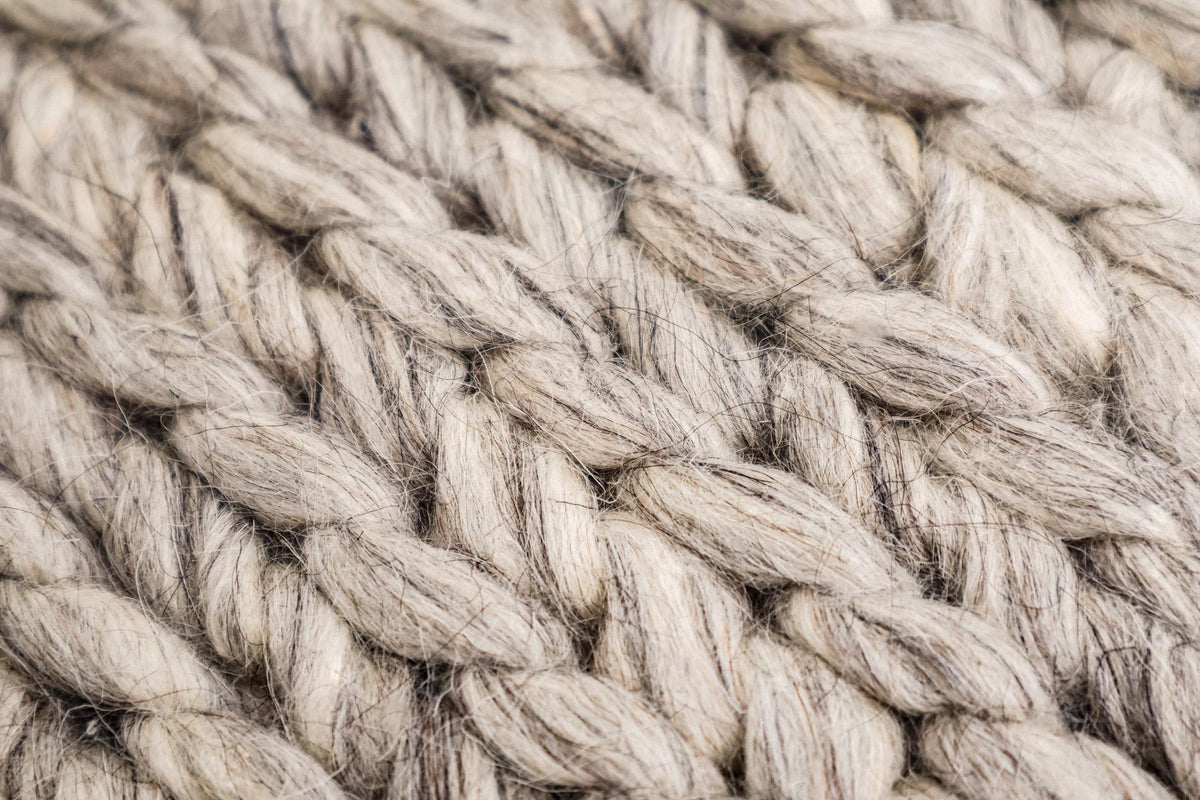 Close-up of chunky braided wool loop pile texture