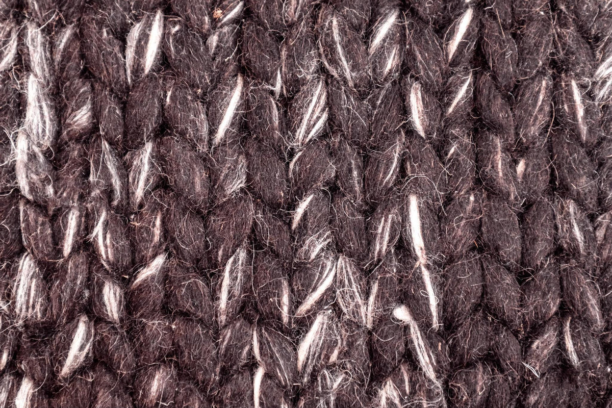 Chunky wool rug texture and color close-up
