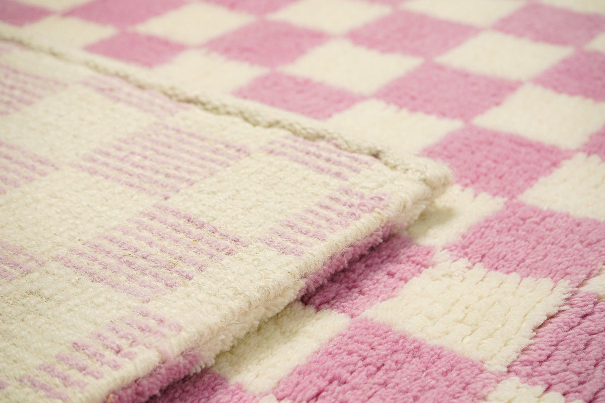 Wool rug styled in bedroom