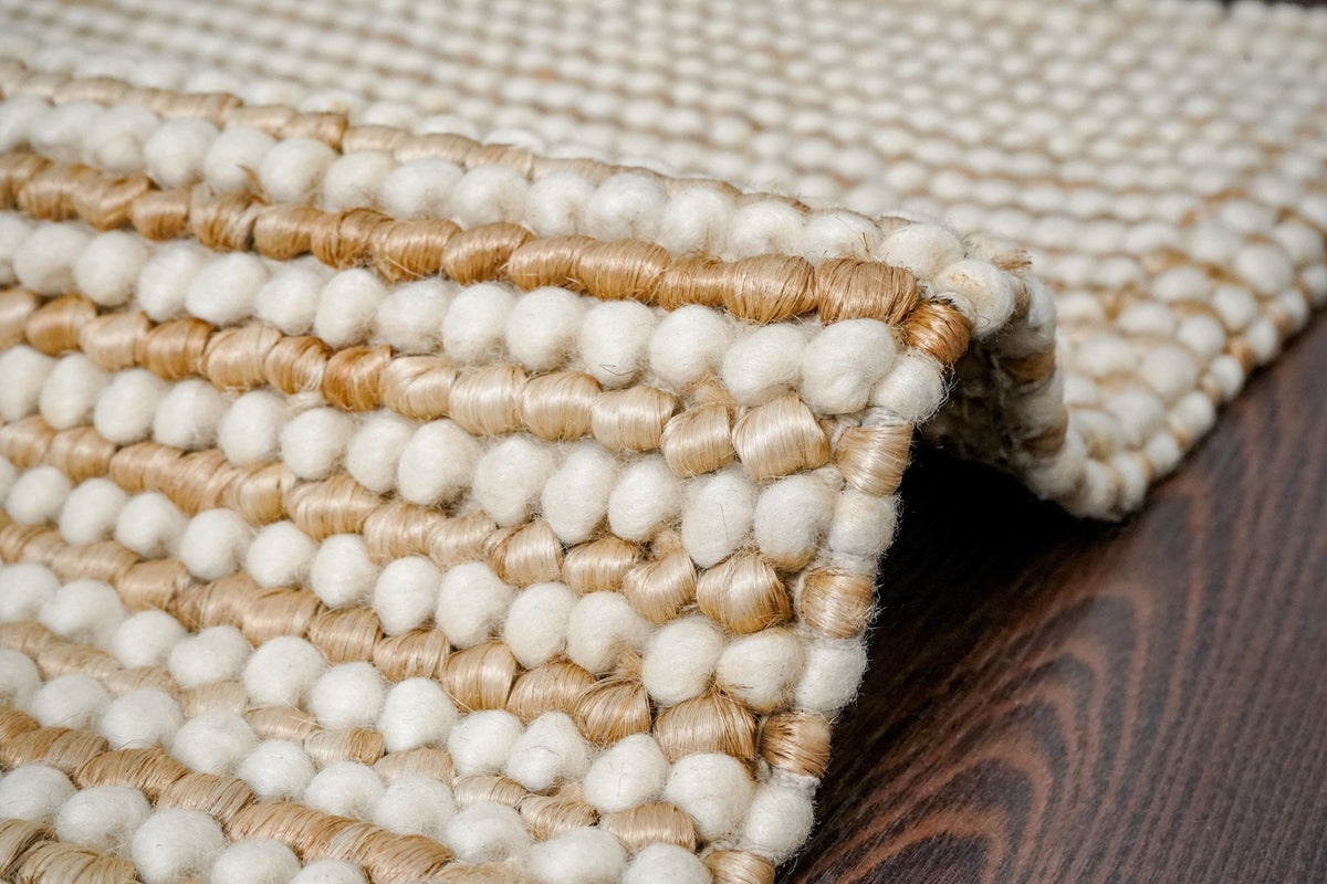 Natural wool jute chunky rug laid flat showing striped pattern