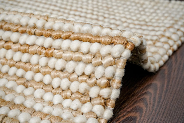 Natural wool jute chunky rug laid flat showing striped pattern