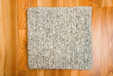 Wool rug pile texture close-up detail