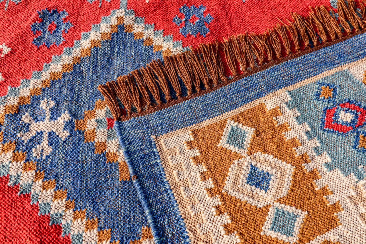 Aztec pattern kilim rug on a covered patio