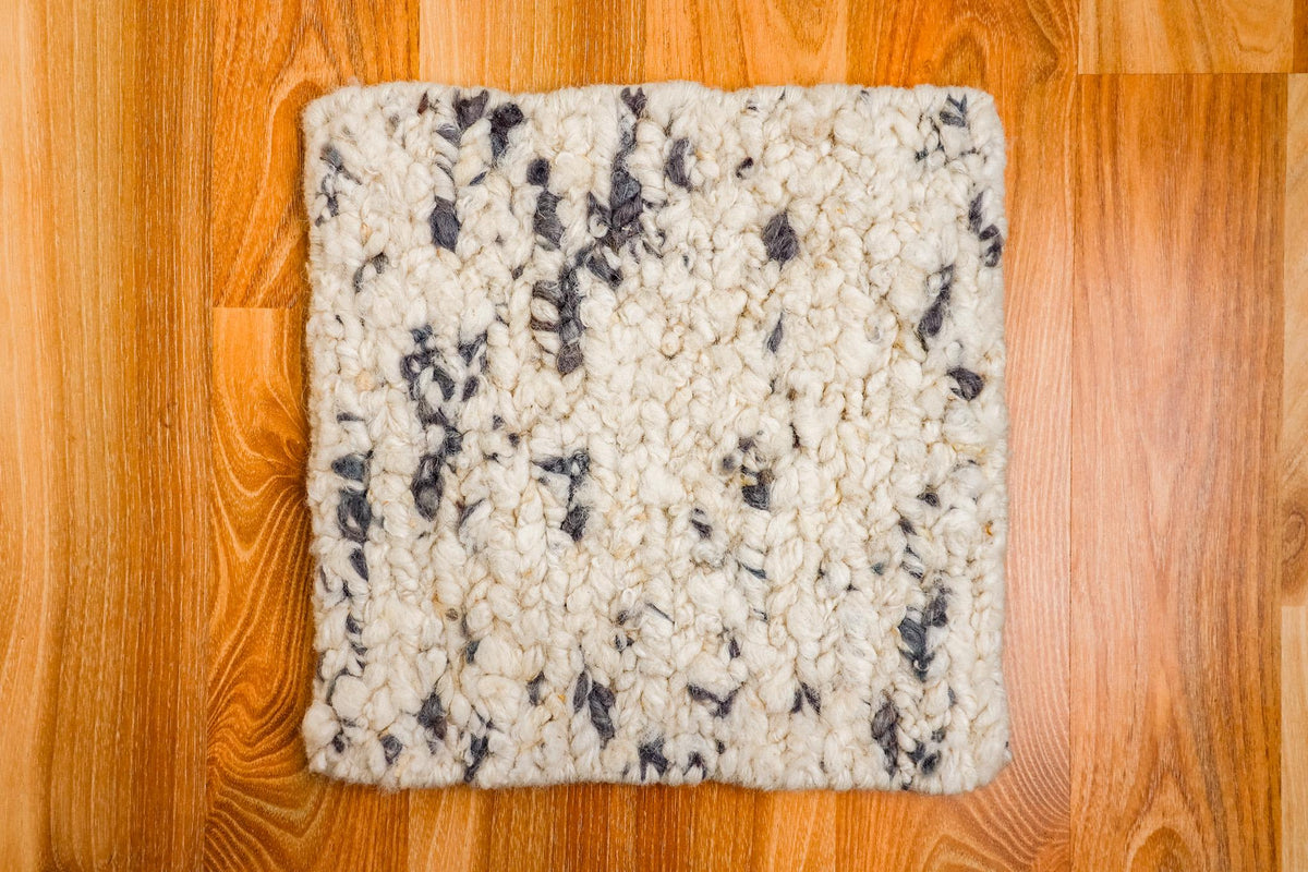 Chunky wool rug texture and color close-up