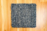 Full room view with multi textured wool rug