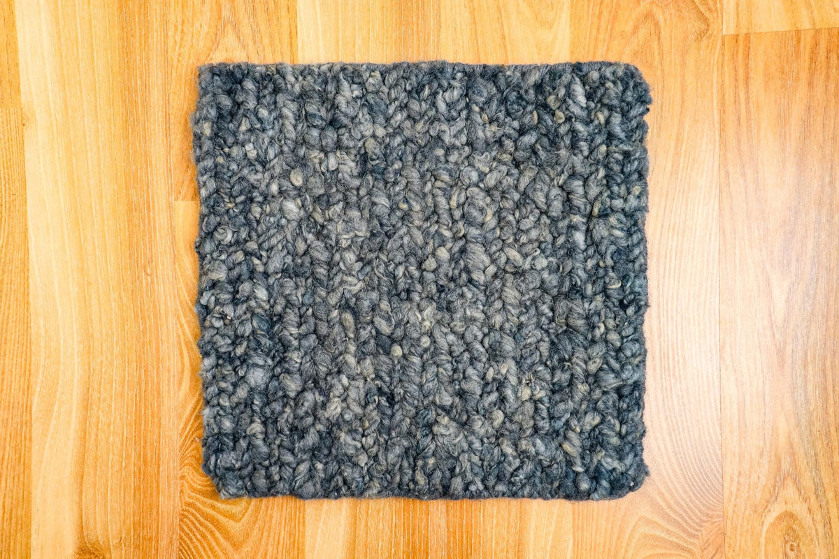 Full room view with multi textured wool rug