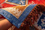 Kilim rug corner detail showing flatweave edge and fringe