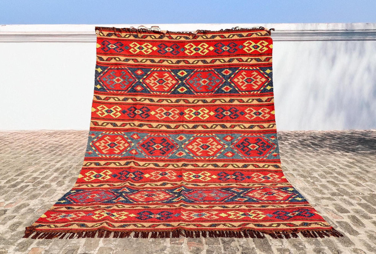 Red Afghan style kilim rug flat view showing full pattern