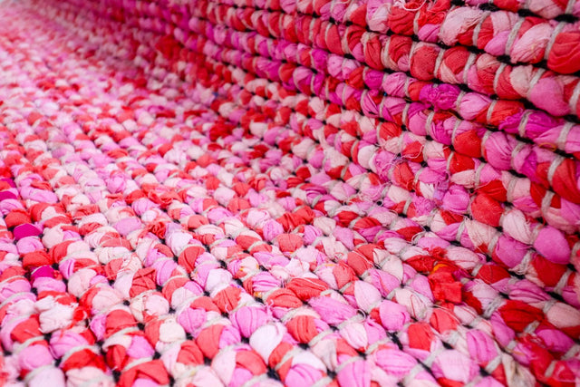 Chindi rag rug styled in a colorful bedroom