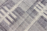 Grey beige rug fringe and braid detail