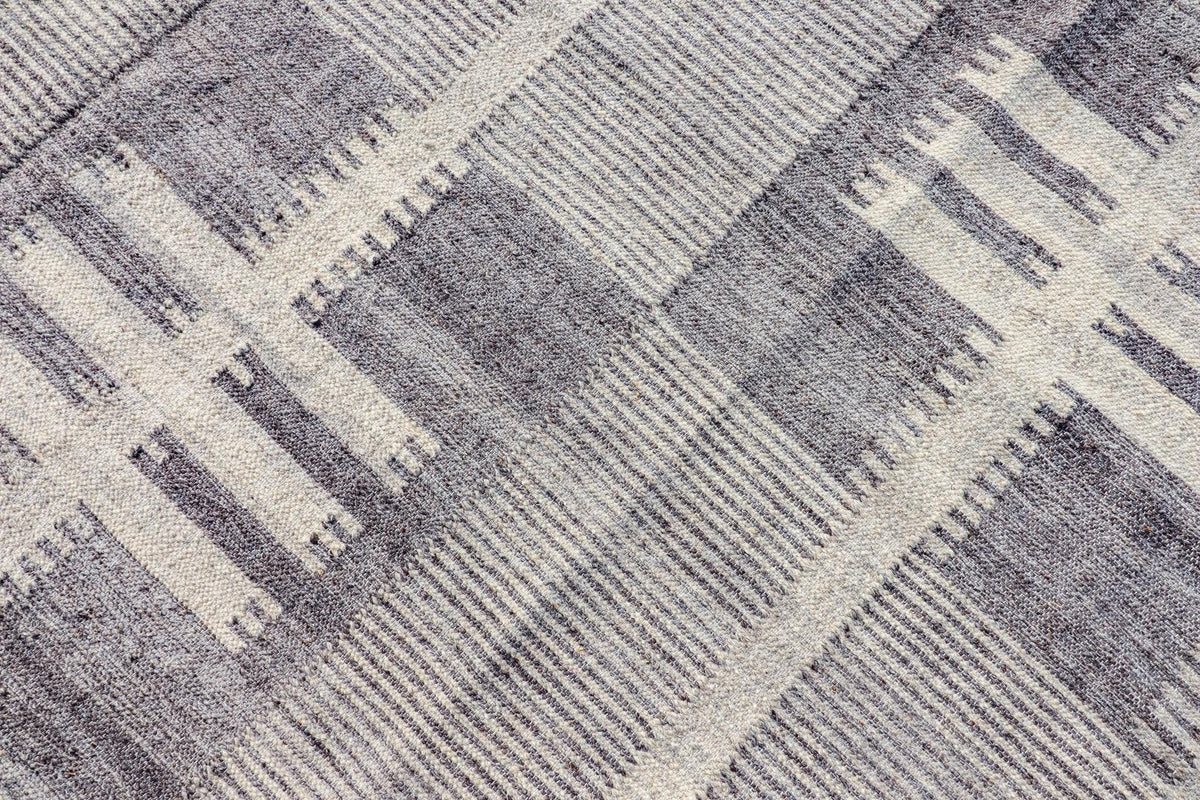 Grey beige rug fringe and braid detail
