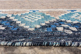 Blue oval indoor outdoor rug on a covered porch